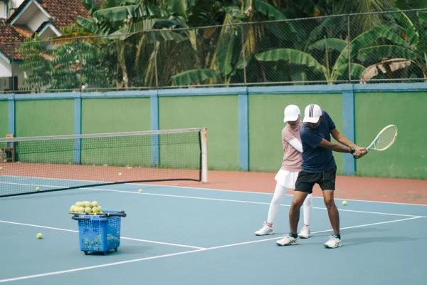 female tennis player coach
